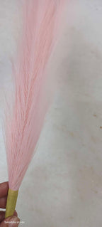 Pink artificial pompas filler sticks bundle held in hand, straight stem floral filler for vase arrangements