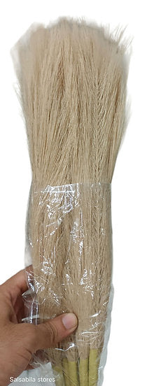 Pink artificial pompas filler sticks bundle held in hand, straight stem floral filler for vase arrangements
