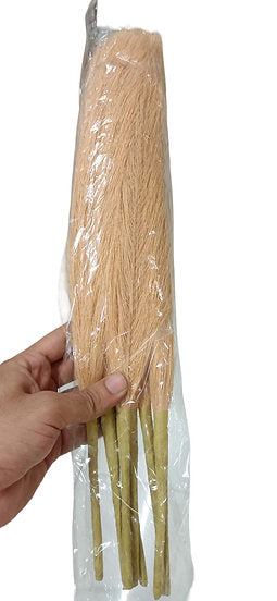 Pink artificial pompas filler sticks bundle held in hand, straight stem floral filler for vase arrangements